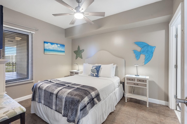 tiled bedroom featuring a ceiling fan and baseboards