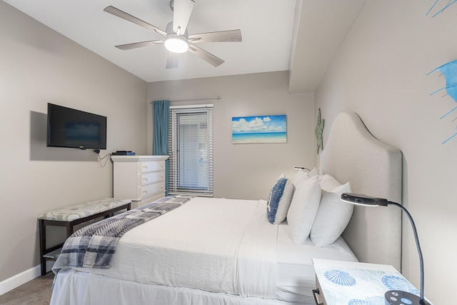 bedroom with baseboards and a ceiling fan