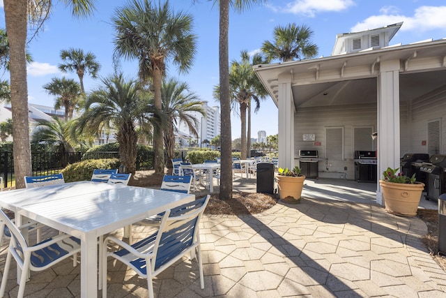 view of patio / terrace with outdoor dining area and fence