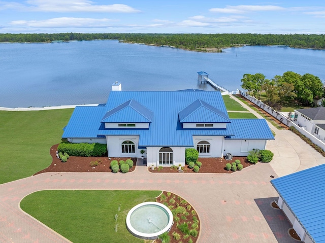 exterior space featuring a water view and driveway