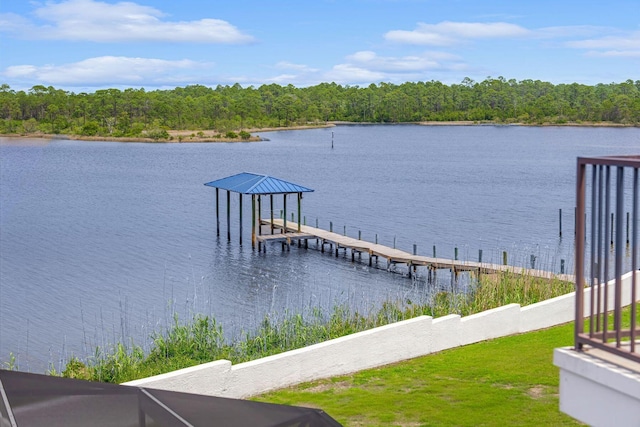 dock area with a water view, a forest view, and boat lift