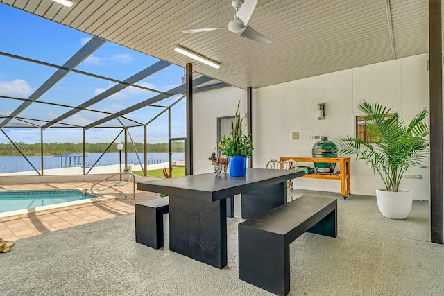 view of patio featuring an outdoor pool, ceiling fan, outdoor dry bar, a water view, and a lanai