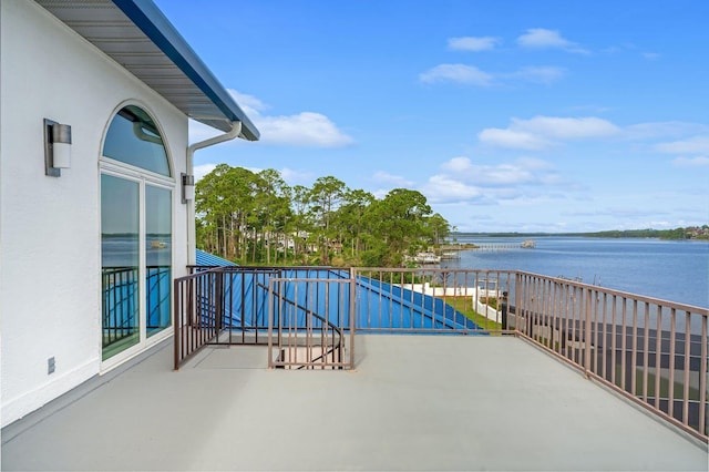 balcony featuring a water view