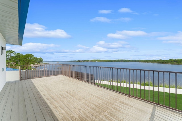 deck featuring a water view and a yard