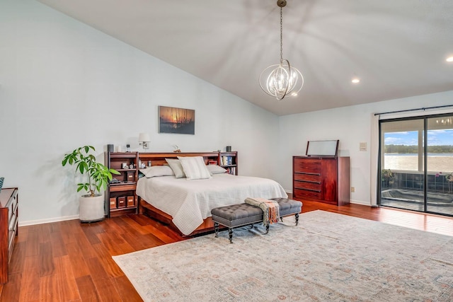 bedroom featuring a notable chandelier, baseboards, vaulted ceiling, access to outside, and dark wood finished floors