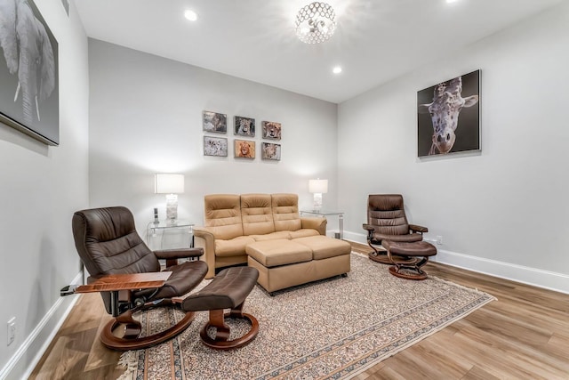 living area featuring recessed lighting, wood finished floors, and baseboards