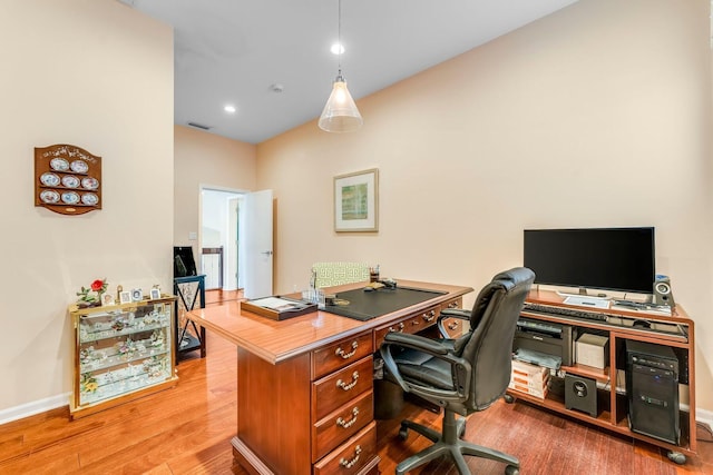 office space with recessed lighting, visible vents, baseboards, and wood finished floors