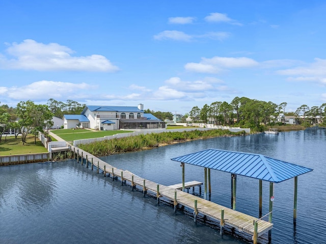 view of dock featuring a yard and a water view