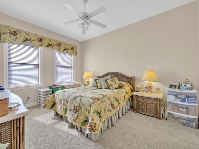 bedroom with carpet floors, a ceiling fan, and baseboards