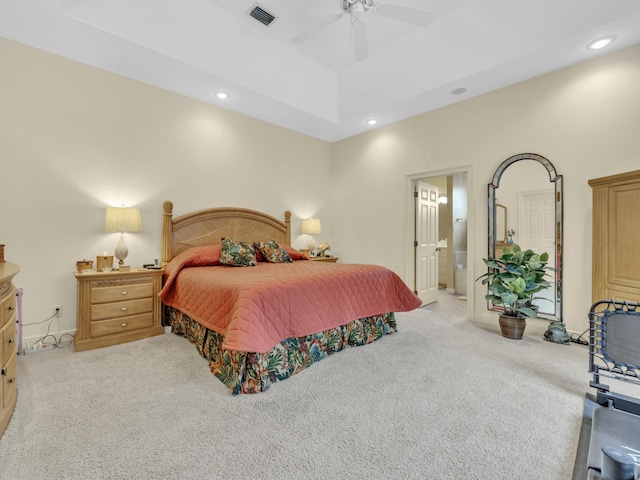 carpeted bedroom with recessed lighting, visible vents, ceiling fan, and ensuite bath