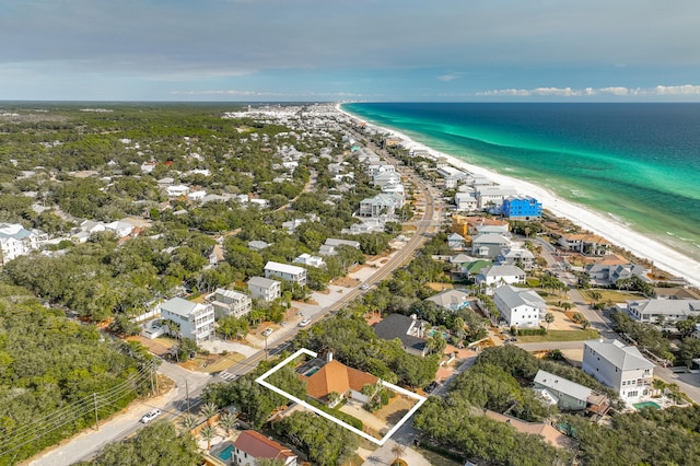 birds eye view of property with a view of the beach and a water view