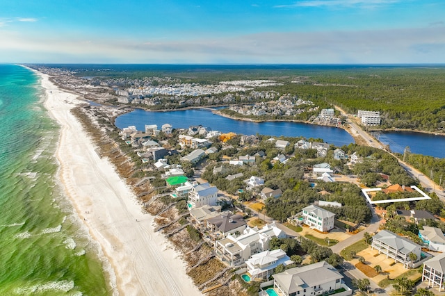 birds eye view of property featuring a view of the beach and a water view