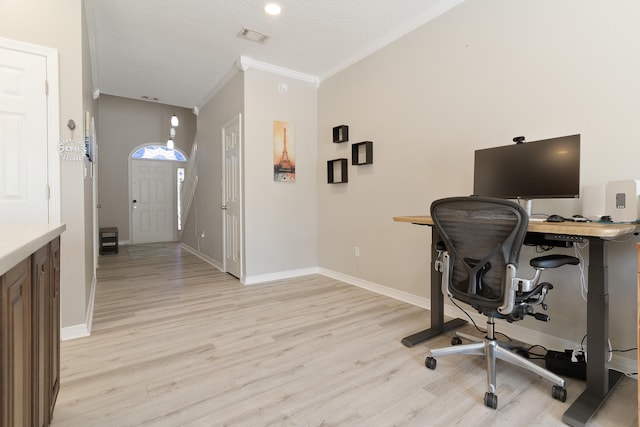 office area with visible vents, light wood-style flooring, baseboards, and ornamental molding