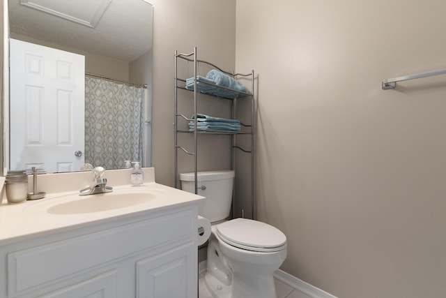 bathroom featuring vanity, toilet, and a shower with curtain