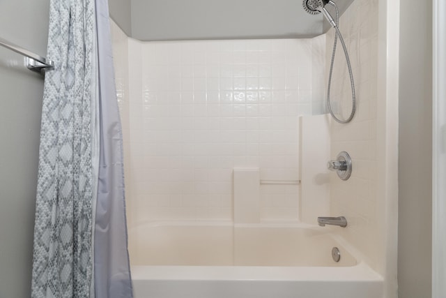 full bath featuring shower / tub combo with curtain