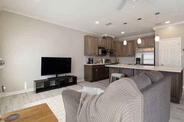 living room featuring light wood-style flooring and visible vents