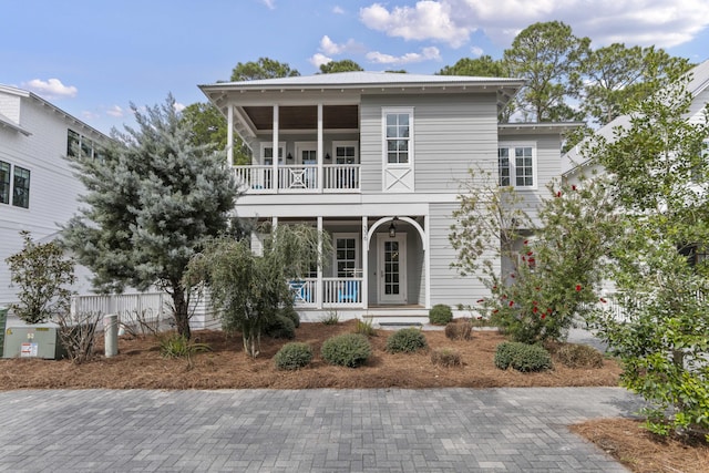 view of front of home featuring a porch and a balcony