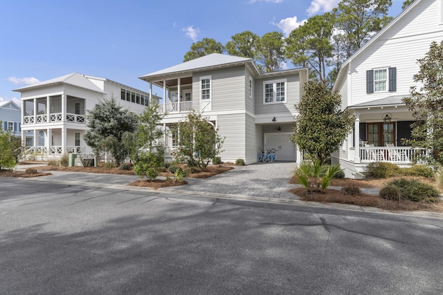 view of front of home featuring a garage and decorative driveway