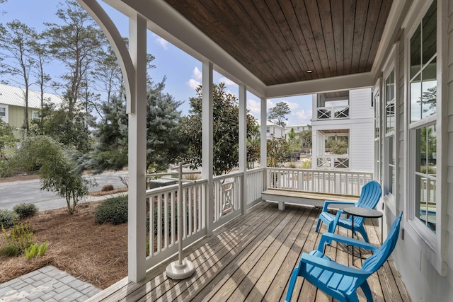 sunroom with wood ceiling