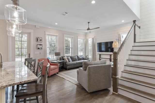 living area featuring ceiling fan, stairs, dark wood finished floors, and recessed lighting