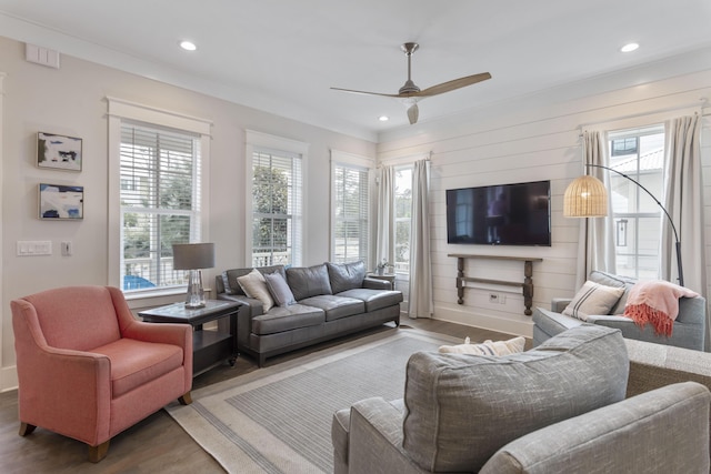 living room with ceiling fan, crown molding, wood finished floors, and recessed lighting