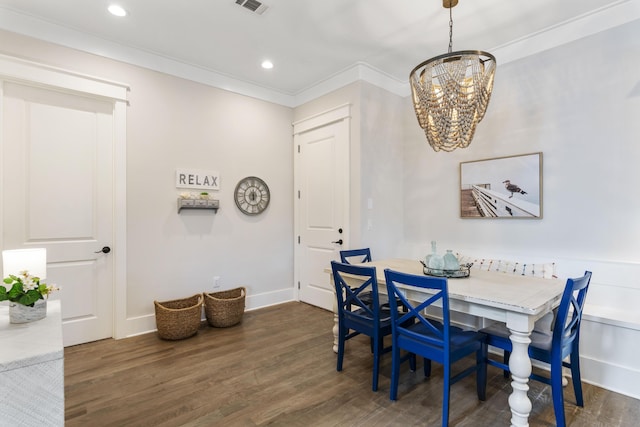 dining area featuring ornamental molding, wood finished floors, and recessed lighting