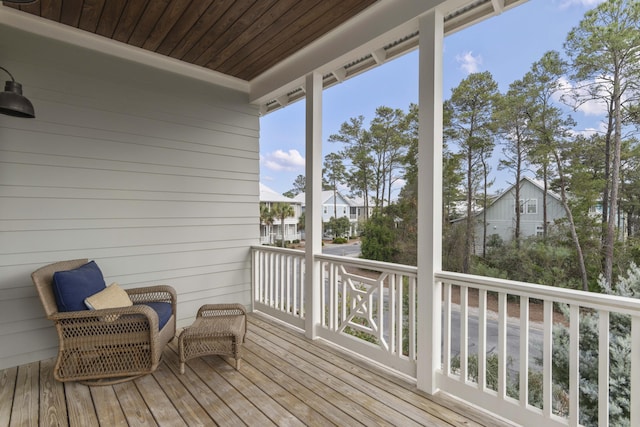 wooden terrace with a residential view