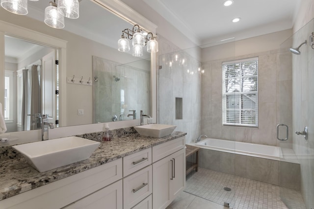 full bath featuring a relaxing tiled tub, tile patterned flooring, a sink, and a shower stall