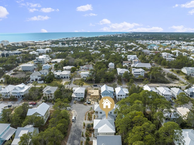 drone / aerial view featuring a water view and a residential view