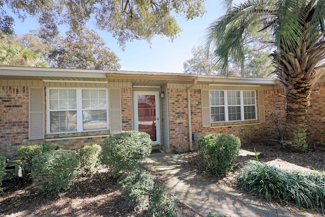 single story home with brick siding