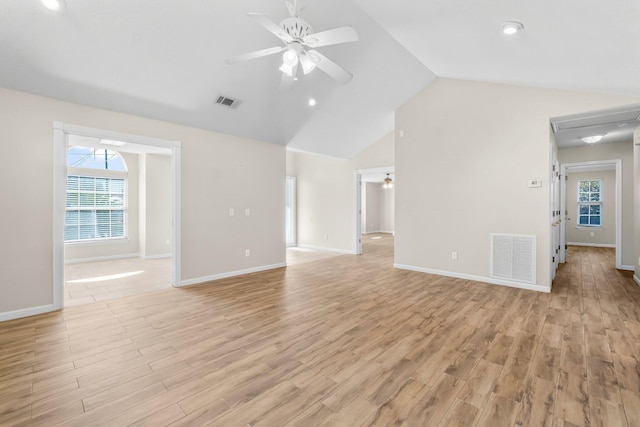 unfurnished living room featuring a ceiling fan, lofted ceiling, visible vents, and light wood-style flooring