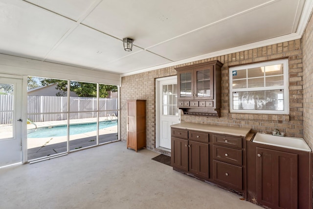 sunroom / solarium featuring a sink