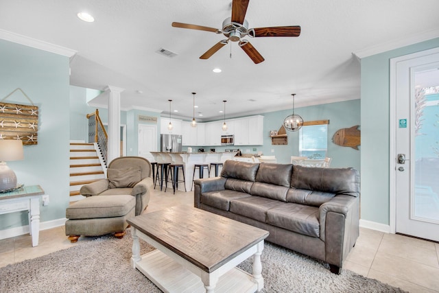 living area with crown molding, recessed lighting, visible vents, stairway, and light tile patterned flooring