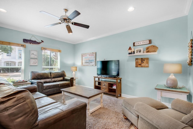 living area featuring baseboards, recessed lighting, a ceiling fan, and crown molding