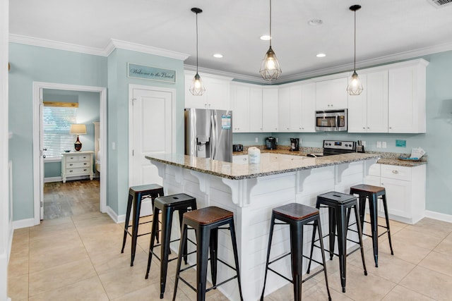 kitchen with stainless steel appliances, light tile patterned flooring, crown molding, and white cabinetry