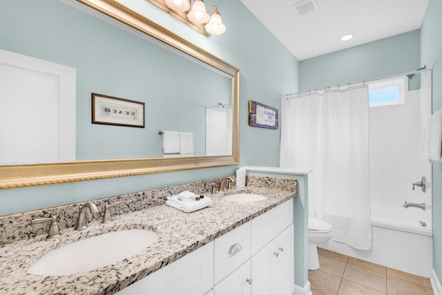 full bathroom with visible vents, a sink, toilet, and tile patterned floors