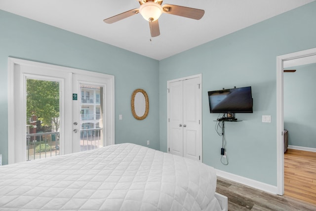 bedroom featuring access to exterior, french doors, ceiling fan, wood finished floors, and baseboards