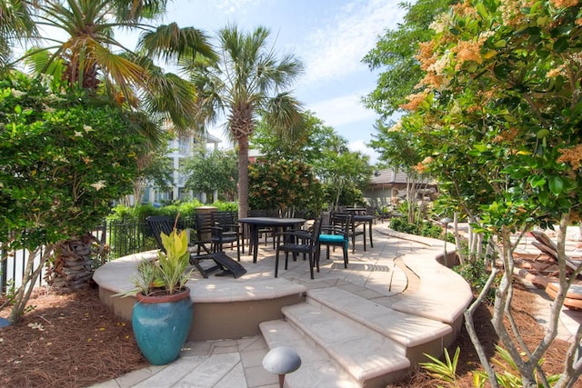 view of patio / terrace with outdoor dining area and fence