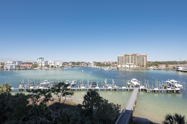 property view of water with a boat dock and a city view