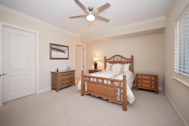 carpeted bedroom featuring baseboards, ceiling fan, and crown molding