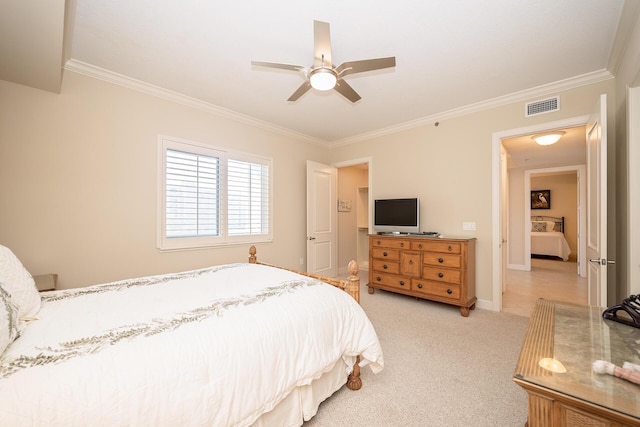 bedroom with light colored carpet, visible vents, ornamental molding, ceiling fan, and baseboards