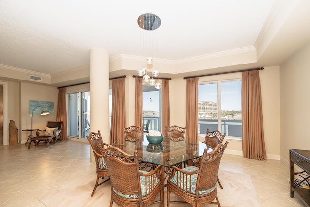 dining room featuring light tile patterned floors, baseboards, visible vents, and ornamental molding