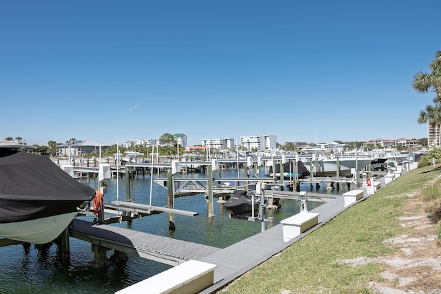 dock area with a water view and boat lift