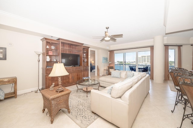 living room featuring light tile patterned flooring, crown molding, and ceiling fan