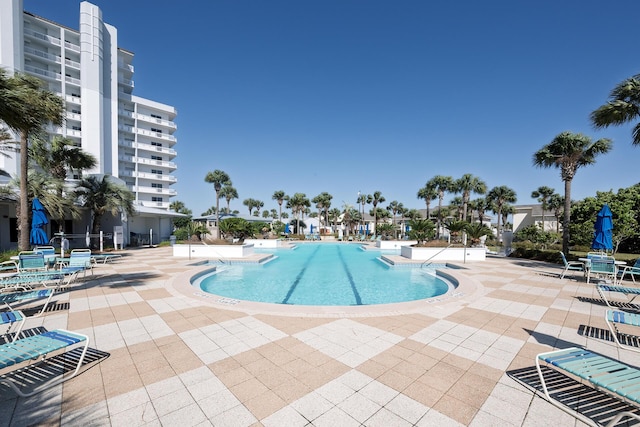 community pool with a patio area