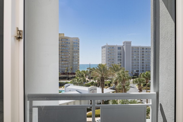 balcony with a water view and a city view