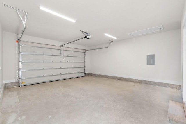 garage featuring a garage door opener, electric panel, and baseboards