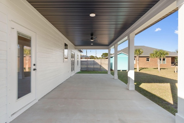 view of patio / terrace featuring fence and a ceiling fan