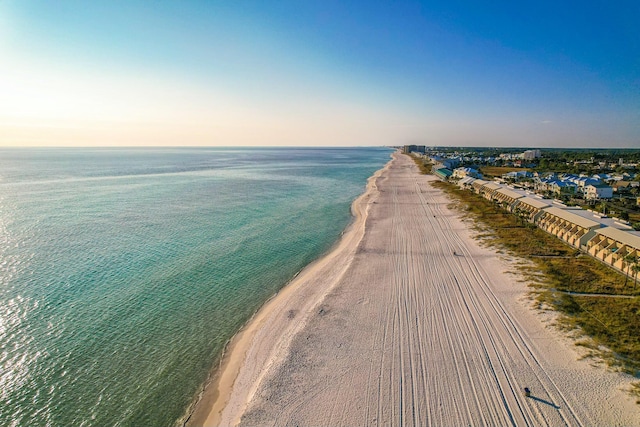 bird's eye view with a beach view and a water view