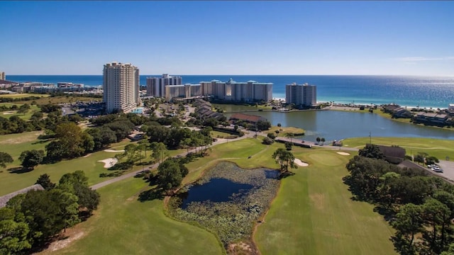 birds eye view of property with a water view and a city view